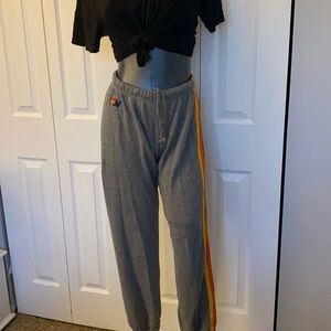 Aviator Nation gray sweatpants with rainbow stripes